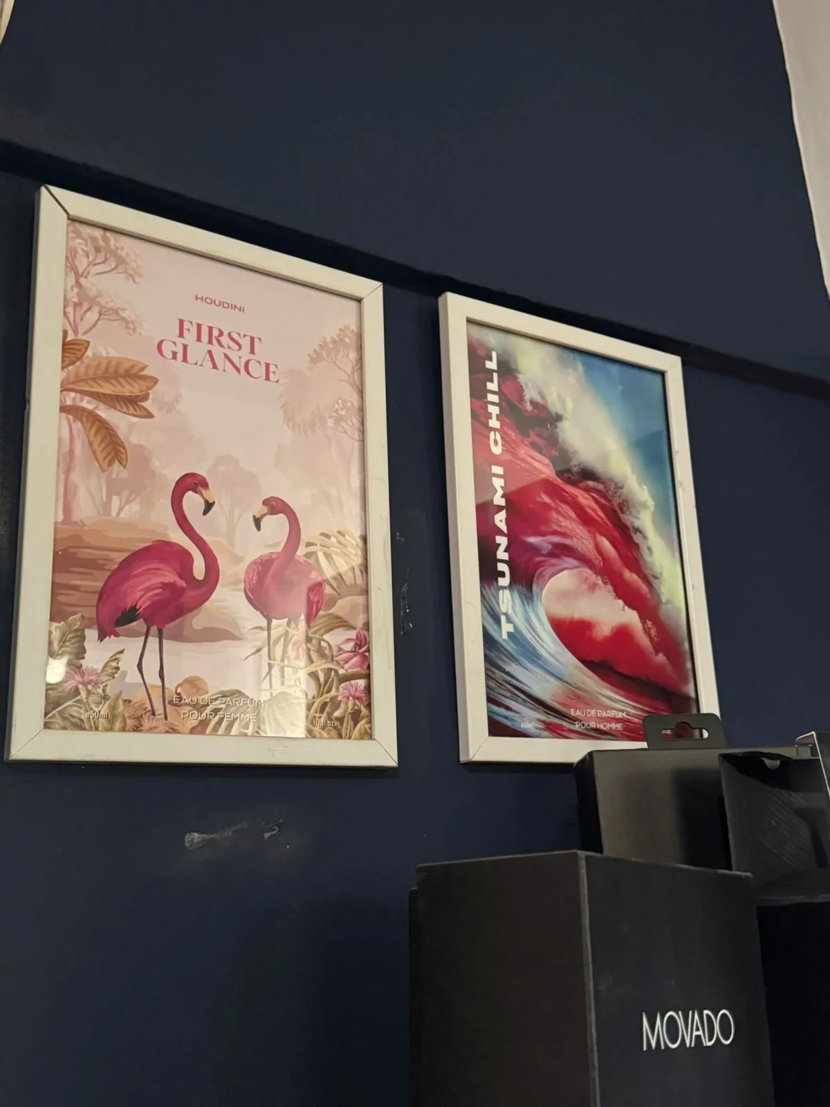 Houdini Perfumes First Glance and Tsunami Chill posters framed on a wall